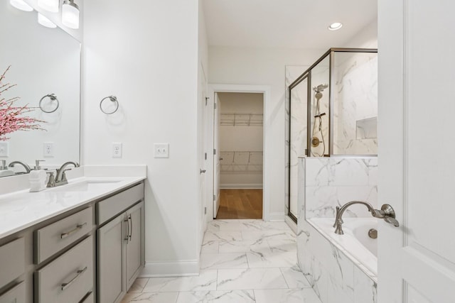 6807 Kew Gdn, Smyrna, TN 37167 - bathroom with marble finish floors, a marble finish shower, vanity, a bath, and a spacious closet