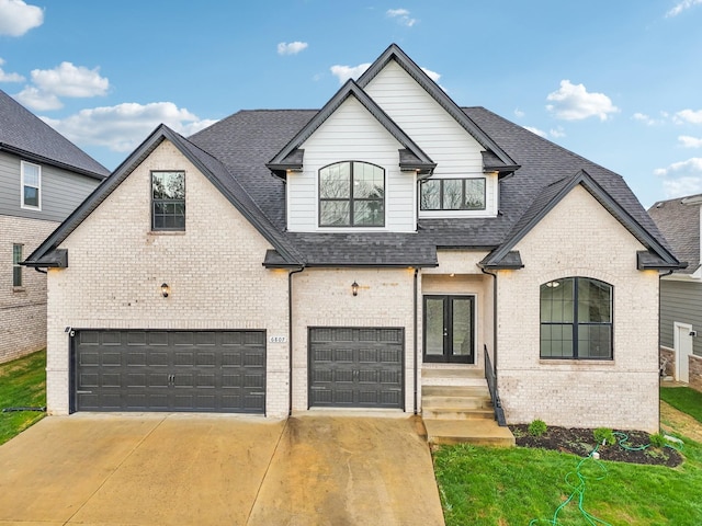 6807 Kew Gdn, Smyrna, TN 37167 - french country inspired facade with an attached garage, brick siding, and roof with shingles