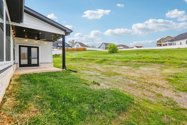 6807 Kew Gdn, Smyrna, TN 37167 - view of green lawn with french doors, a residential view, and a ceiling fan