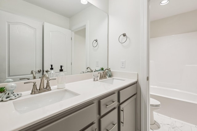 6807 Kew Gdn, Smyrna, TN 37167 - full bathroom featuring double vanity, marble look tiles, and recessed lighting