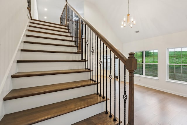 6807 Kew Gdn, Smyrna, TN 37167 - stairway with a chandelier, wood finished floors, and lofted ceiling