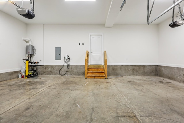6807 Kew Gdn, Smyrna, TN 37167 - garage with electric panel, a garage door opener, and tankless water heater