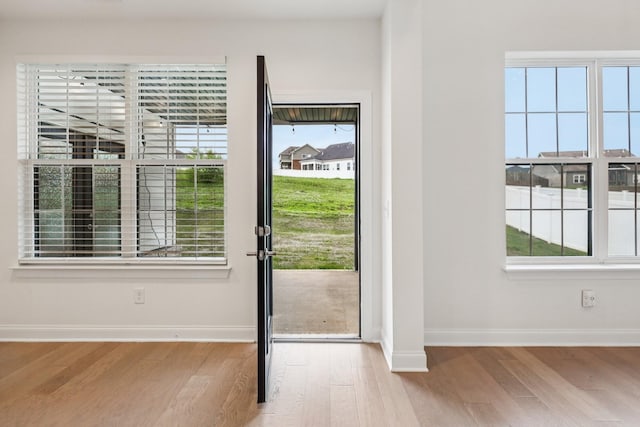6807 Kew Gdn, Smyrna, TN 37167 - doorway to outside featuring wood finished floors and baseboards