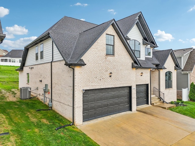 6807 Kew Gdn, Smyrna, TN 37167 - view of side of home with brick siding, an attached garage, driveway, and a yard