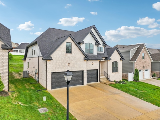 6807 Kew Gdn, Smyrna, TN 37167 - french country home with a garage, driveway, a front yard, and roof with shingles