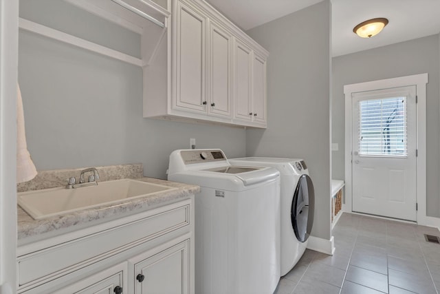 1924 Fairhaven Ln, Murfreesboro, TN 37128 - laundry room featuring separate washer and dryer, cabinet space, and light tile patterned flooring
