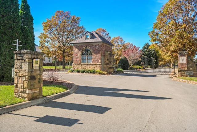 1924 Fairhaven Ln, Murfreesboro, TN 37128 - view of asphalt road featuring curbs, a gate, and a gated entry