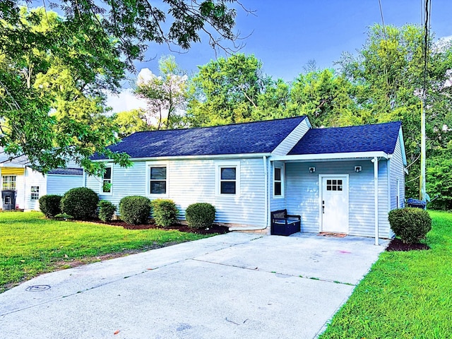 1039 Brown Ave, Cookeville, TN 38501 - view of front of house with a front yard, a shingled roof, and driveway
