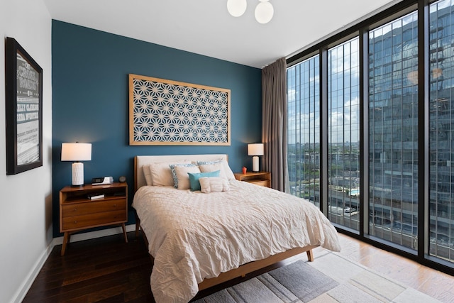 1212 Laurel St Unit 1106, Nashville, TN 37203 - bedroom with multiple windows, a wall of windows, access to exterior, and wood finished floors