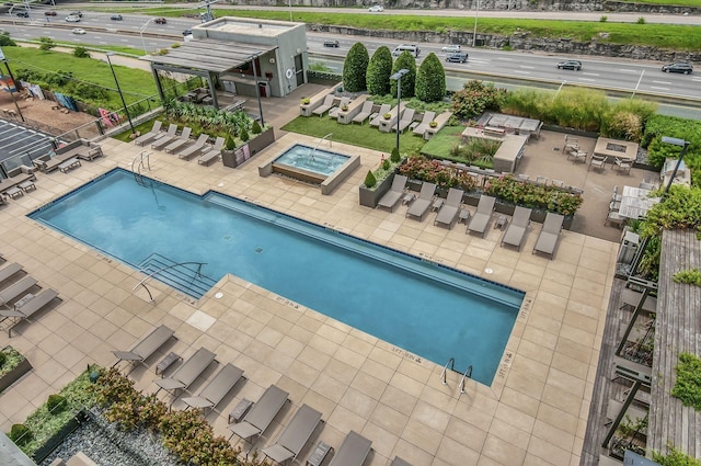 1212 Laurel St Unit 1106, Nashville, TN 37203 - community pool featuring a hot tub and a patio