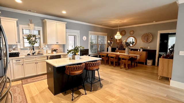 1248 Hensfield Dr, Murfreesboro, TN 37128 - kitchen with light countertops, backsplash, light wood-style floors, ornamental molding, and recessed lighting