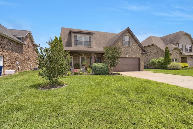 1248 Hensfield Dr, Murfreesboro, TN 37128 - view of front of house featuring concrete driveway, brick siding, and a front lawn