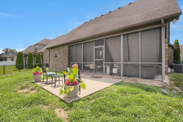 1248 Hensfield Dr, Murfreesboro, TN 37128 - rear view of house featuring brick siding, a patio, roof with shingles, and a sunroom
