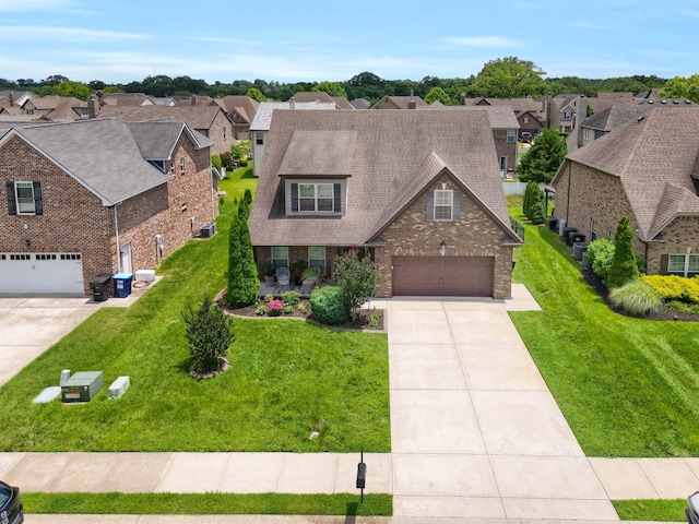 1248 Hensfield Dr, Murfreesboro, TN 37128 - view of front of house featuring a residential view, concrete driveway, an attached garage, a front lawn, and roof with shingles
