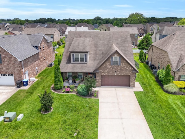 1248 Hensfield Dr, Murfreesboro, TN 37128 - view of front of house with a residential view, driveway, a shingled roof, a front yard, and brick siding