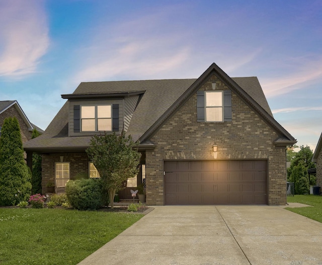 1248 Hensfield Dr, Murfreesboro, TN 37128 - view of front of home featuring concrete driveway, brick siding, a front lawn, and roof with shingles