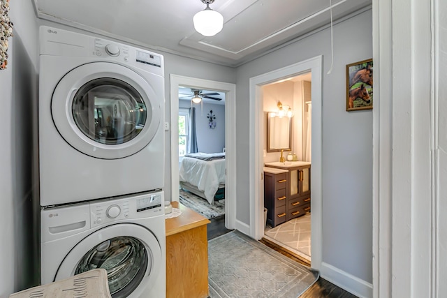 106 S Locust St S, Mount Pleasant, TN 38474 - laundry room featuring stacked washer and clothes dryer, wood finished floors, and a ceiling fan