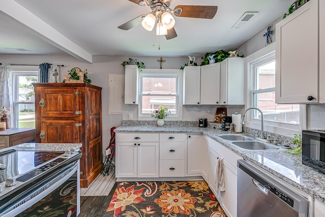 106 S Locust St S, Mount Pleasant, TN 38474 - kitchen with appliances with stainless steel finishes, a ceiling fan, white cabinets, and backsplash