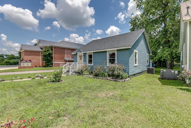 106 S Locust St S, Mount Pleasant, TN 38474 - view of front of house with a front lawn and roof with shingles