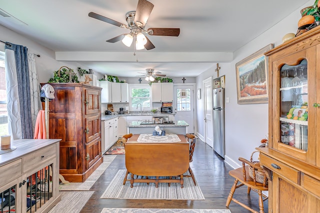 106 S Locust St S, Mount Pleasant, TN 38474 - kitchen featuring freestanding refrigerator, a center island, ceiling fan, white cabinets, and dark wood-style floors
