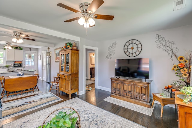 106 S Locust St S, Mount Pleasant, TN 38474 - living room featuring a ceiling fan and dark wood-style floors
