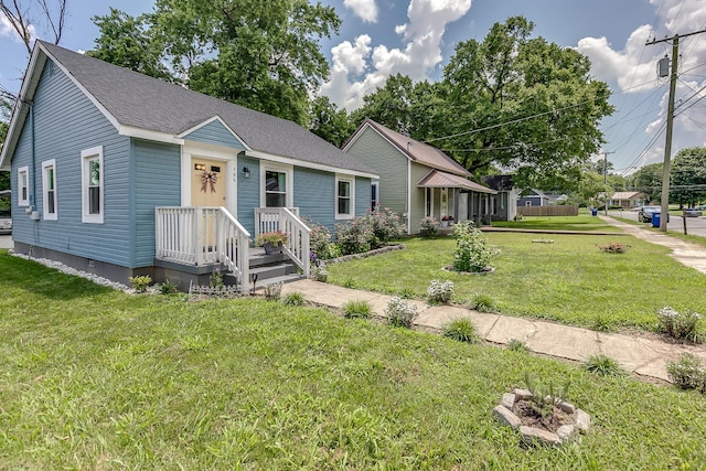 106 S Locust St S, Mount Pleasant, TN 38474 - view of front of property featuring a front yard and a shingled roof