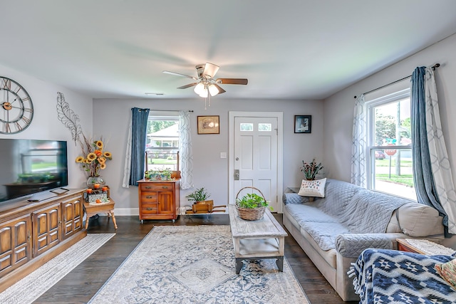 106 S Locust St S, Mount Pleasant, TN 38474 - living room featuring a ceiling fan and dark wood-type flooring