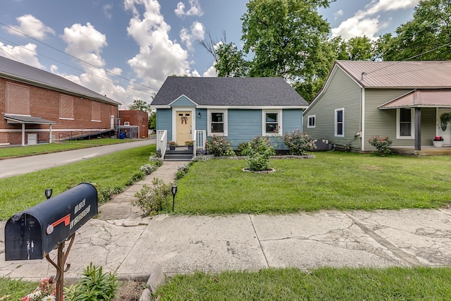 106 S Locust St S, Mount Pleasant, TN 38474 - view of front of home with a front yard and roof with shingles