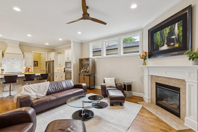 1322 Jewell Ave, Franklin, TN 37064 - living room with ceiling fan, light wood-type flooring, recessed lighting, ornamental molding, and a fireplace with flush hearth