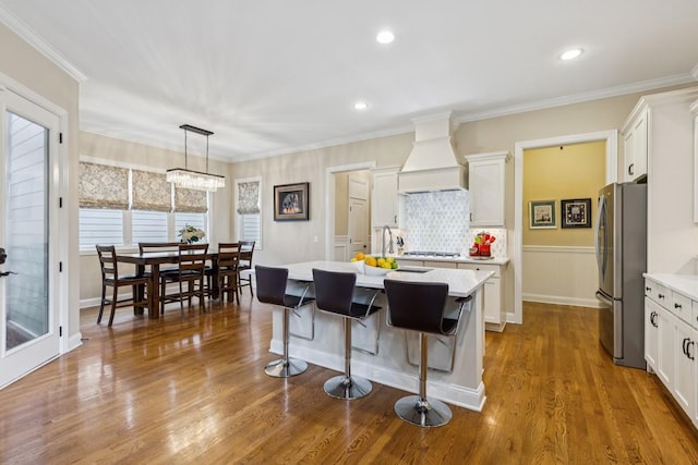 1322 Jewell Ave, Franklin, TN 37064 - kitchen with custom range hood, freestanding refrigerator, light countertops, white cabinetry, and recessed lighting