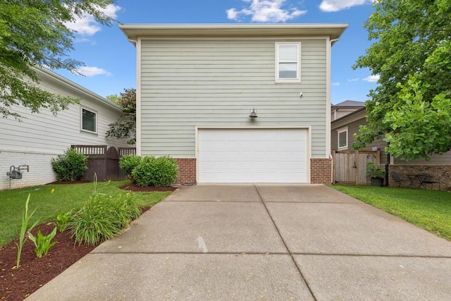 1322 Jewell Ave, Franklin, TN 37064 - view of front of home with brick siding, an attached garage, and driveway