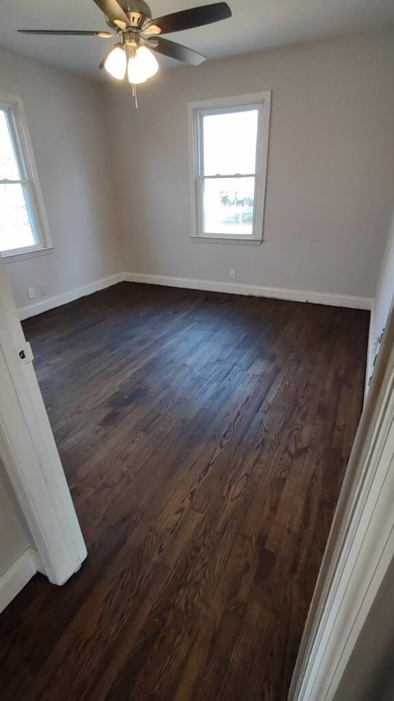918 Velma Ln, Murfreesboro, TN 37129 - empty room with dark wood-type flooring and a ceiling fan