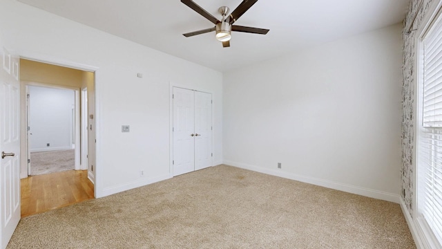 3325 Geneva Dr, Murfreesboro, TN 37128 - unfurnished bedroom with light carpet, a closet, and ceiling fan