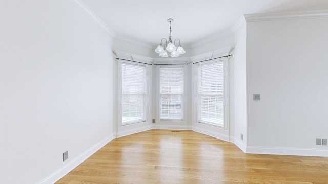 3325 Geneva Dr, Murfreesboro, TN 37128 - unfurnished room featuring a chandelier, crown molding, and light wood-type flooring