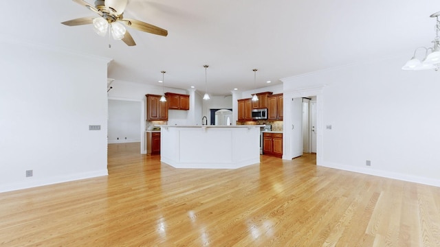 3325 Geneva Dr, Murfreesboro, TN 37128 - unfurnished living room featuring ornamental molding, ceiling fan, and light wood-style floors