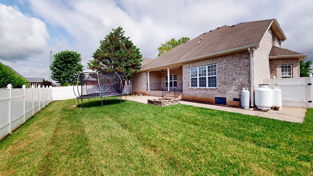 3325 Geneva Dr, Murfreesboro, TN 37128 - rear view of property with a trampoline, brick siding, a patio, and a fenced backyard