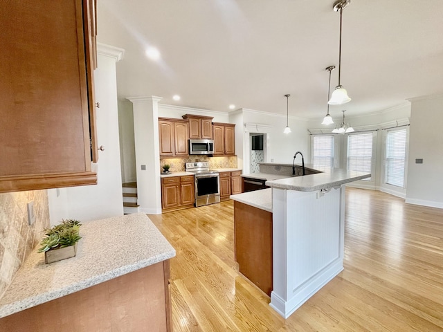 3325 Geneva Dr, Murfreesboro, TN 37128 - kitchen with appliances with stainless steel finishes, light wood-style floors, ornamental molding, backsplash, and brown cabinetry