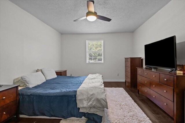 1109 N Charlotte St, Dickson, TN 37055 - bedroom featuring dark wood-type flooring, a textured ceiling, and ceiling fan
