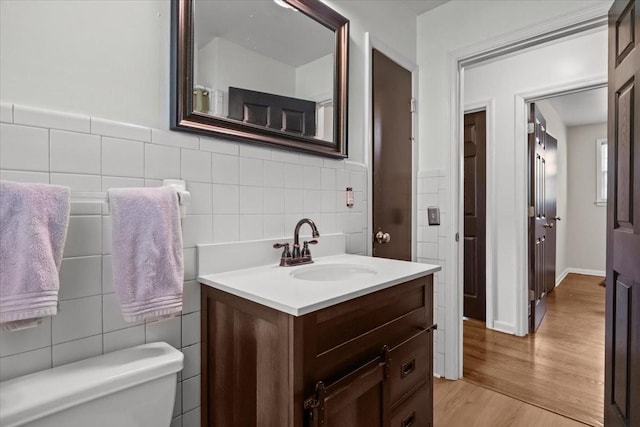 1109 N Charlotte St, Dickson, TN 37055 - bathroom with tile walls, vanity, and wood finished floors