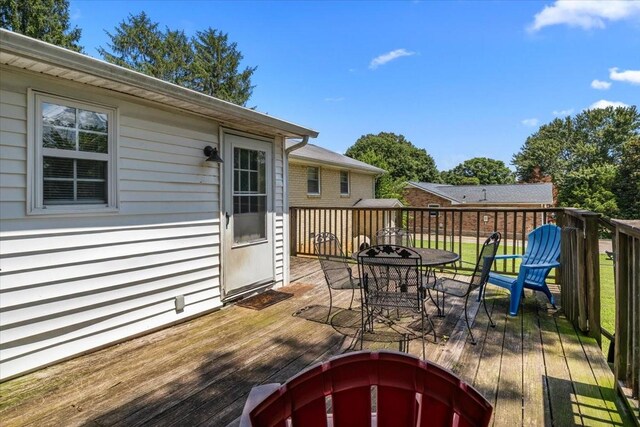 1109 N Charlotte St, Dickson, TN 37055 - wooden deck with outdoor dining area and an outdoor fire pit