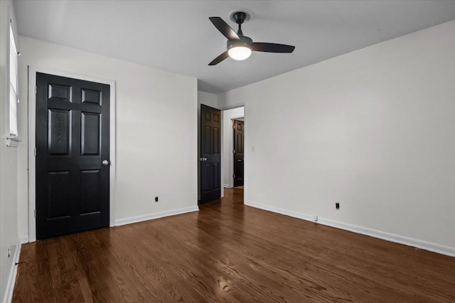 1109 N Charlotte St, Dickson, TN 37055 - unfurnished bedroom featuring dark wood-style flooring and a ceiling fan