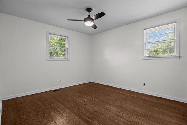 1109 N Charlotte St, Dickson, TN 37055 - unfurnished room featuring dark wood-style flooring and a ceiling fan
