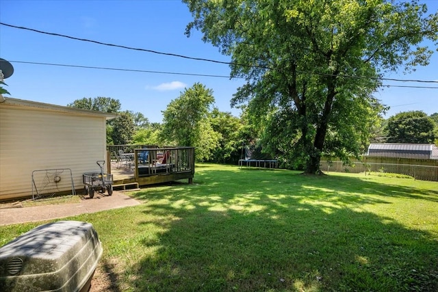 1109 N Charlotte St, Dickson, TN 37055 - view of yard with a trampoline and a deck