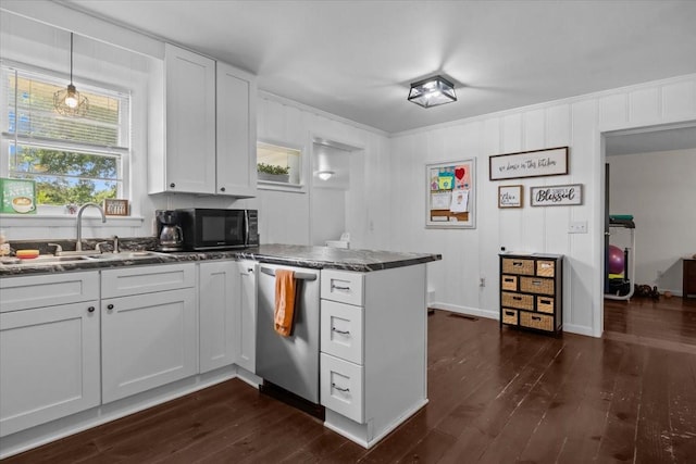 1109 N Charlotte St, Dickson, TN 37055 - kitchen with dishwasher, black microwave, a peninsula, dark wood-style floors, and white cabinets