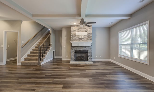 203 Eagles Talon Ct, Clarksville, TN 37040 - unfurnished living room featuring a ceiling fan, beamed ceiling, wood finished floors, stairway, and a stone fireplace