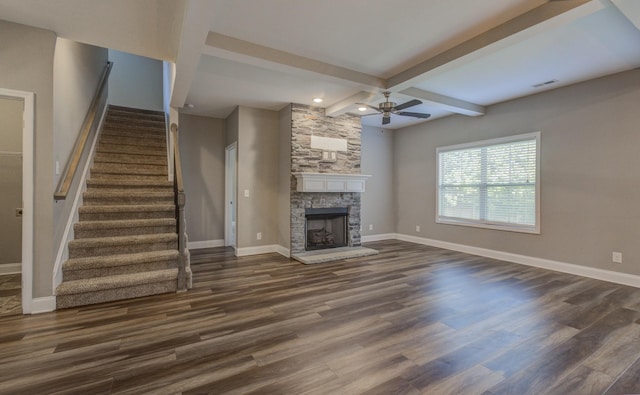 203 Eagles Talon Ct, Clarksville, TN 37040 - unfurnished living room with a ceiling fan, dark wood finished floors, beamed ceiling, stairway, and a fireplace