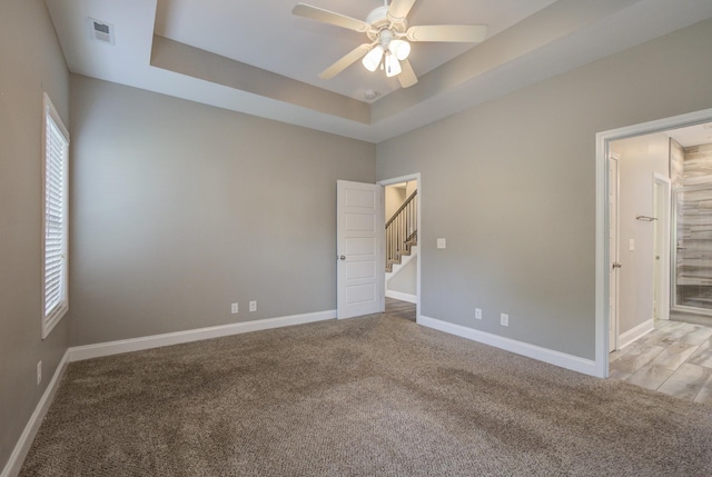 203 Eagles Talon Ct, Clarksville, TN 37040 - unfurnished bedroom with a raised ceiling, carpet, and ceiling fan