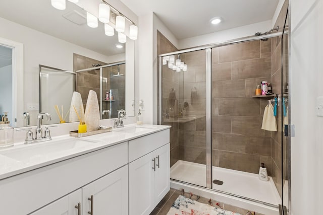 817 Arrington Way, Columbia, TN 38401 - bathroom featuring double vanity, a stall shower, and recessed lighting