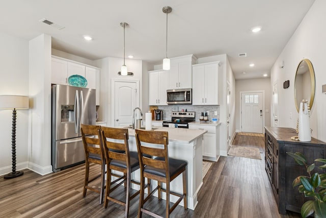817 Arrington Way, Columbia, TN 38401 - kitchen with stainless steel appliances, dark wood-type flooring, light countertops, white cabinets, and recessed lighting