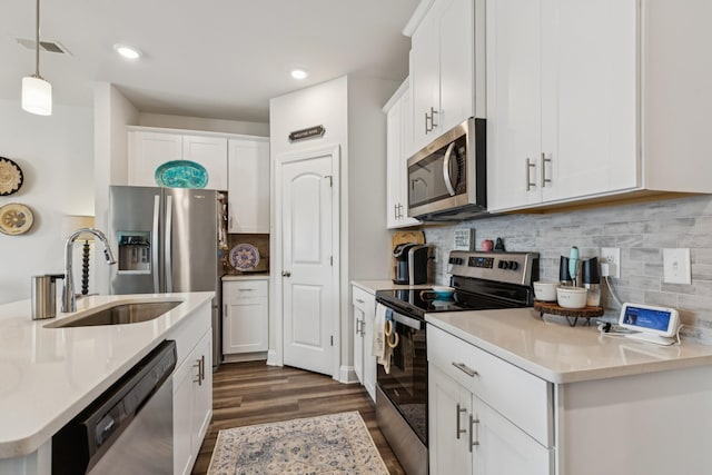 817 Arrington Way, Columbia, TN 38401 - kitchen featuring appliances with stainless steel finishes, dark wood-style flooring, light countertops, white cabinets, and recessed lighting